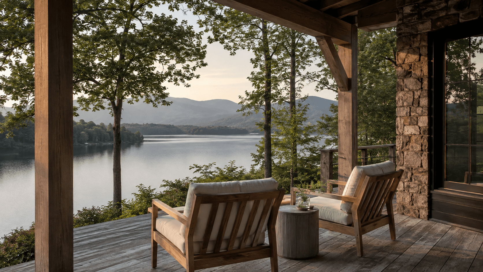 Covered porch with two linen chairs looking out to a North Georgia lake
